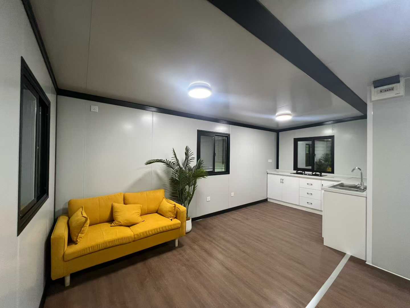 Representative furnished living area inside an expandable container house